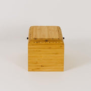 Living Urn | Product image of wooden urn at home. Sustainable bamboo urns for people and pets.